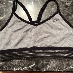 Black and grey Nike sports bra. Light to medium support. Hardly used. Large.